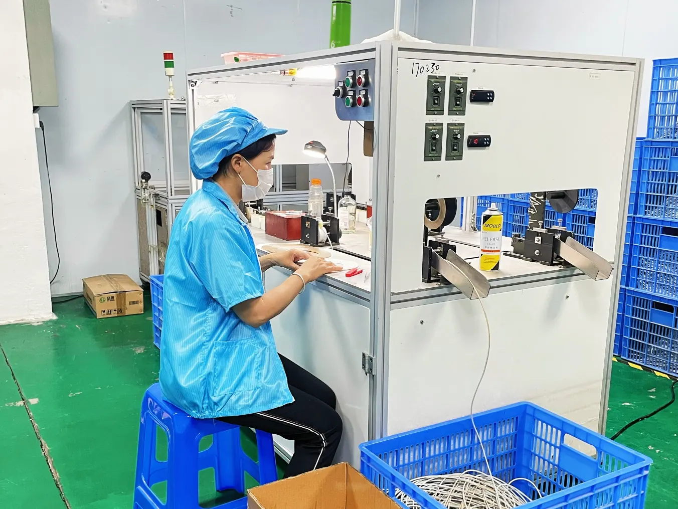 Operator working at foam production equipment in the Dongguan manufacturing workshop